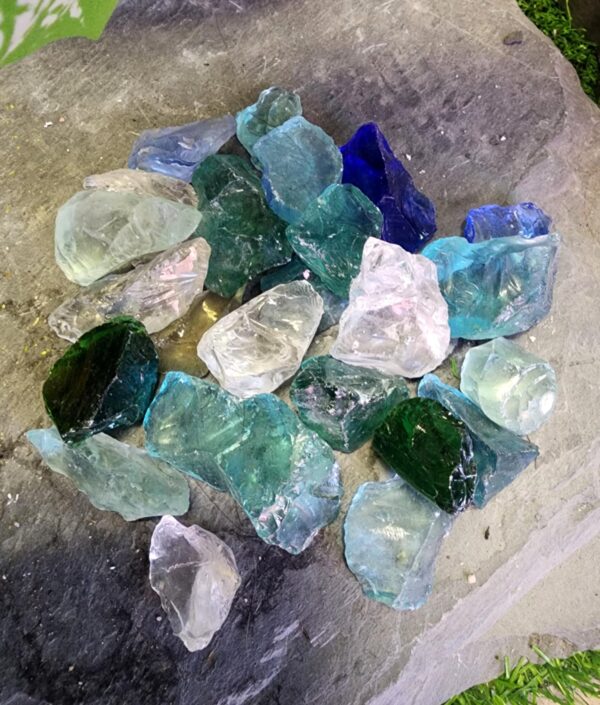 22 lbs. of Emerald City 3-5cm Crushed Glass Rocks Blend ideal for landscaping, crafts, water features, planters.
